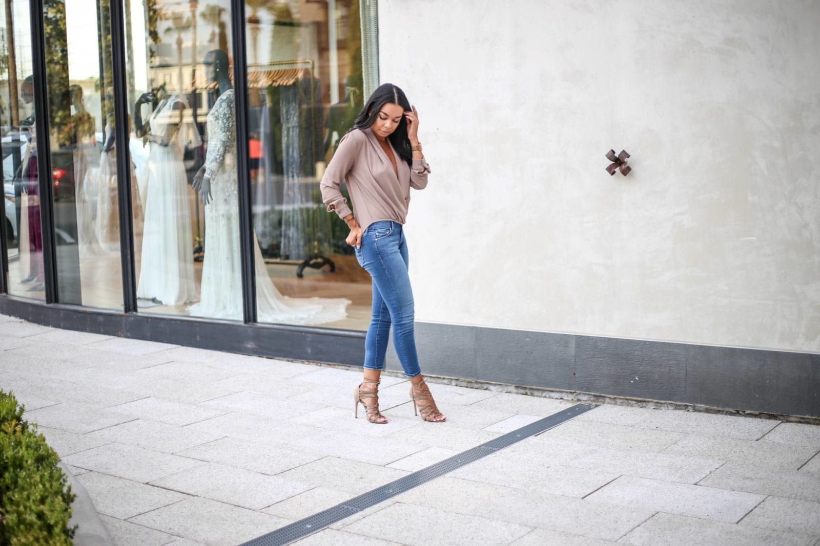 Mother crop denim with a twist front blouse and lace up nude heels