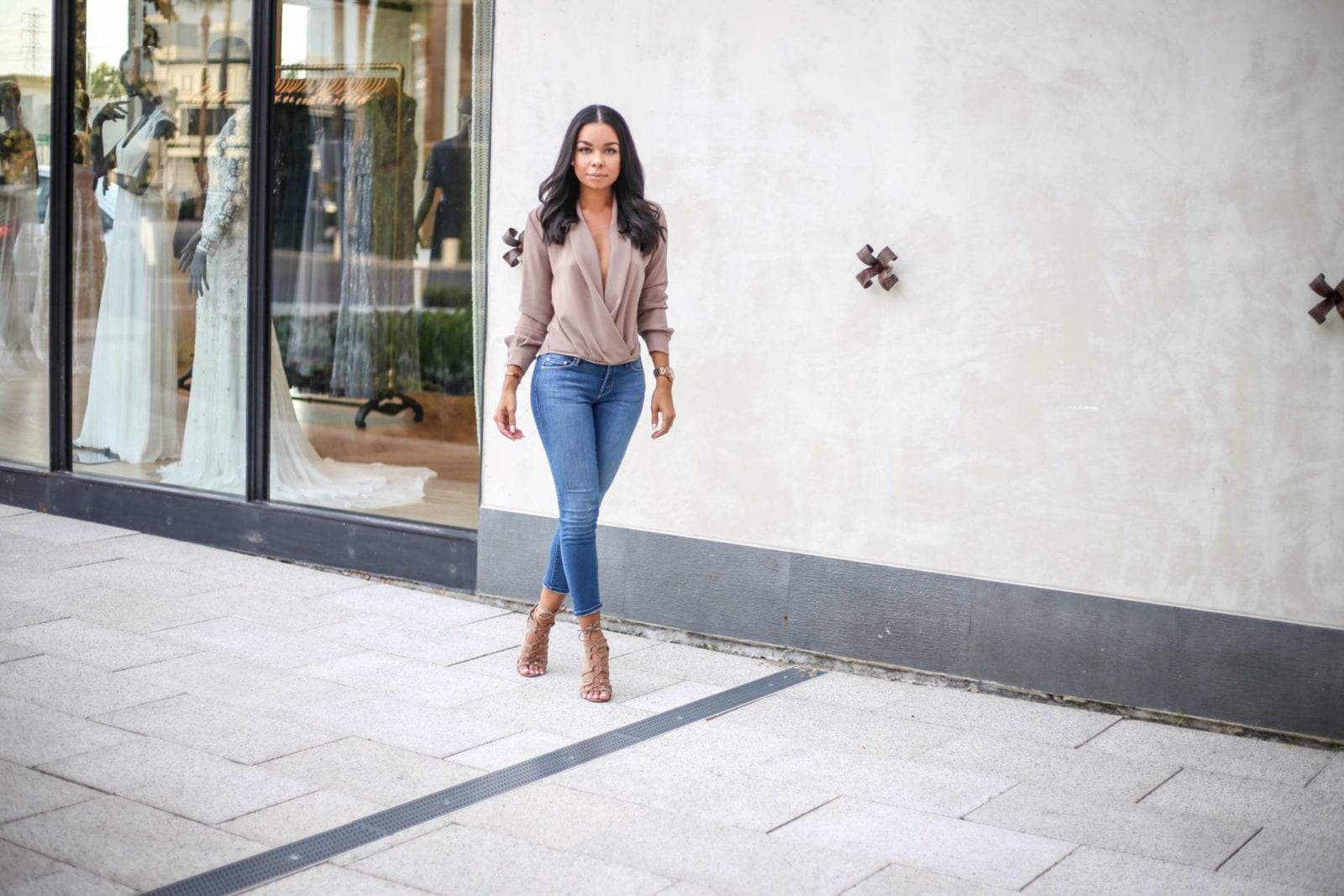 Mother crop denim with a twist front blouse and lace up nude heels