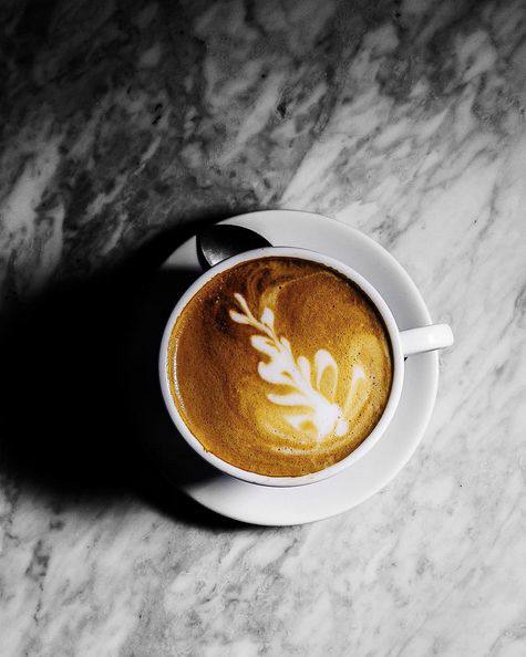 Latte art coffee on marble.