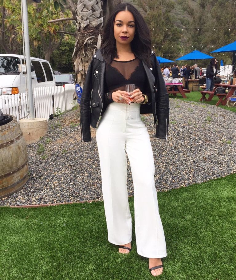 Woman in white pants outfit