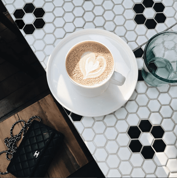 Latte art with a black purse