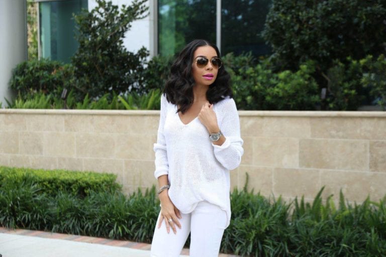 Woman in white outfit outdoors
