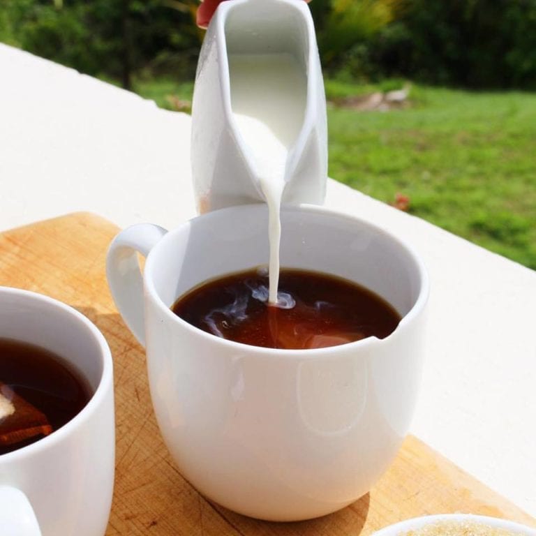 Cream poured into hot coffee