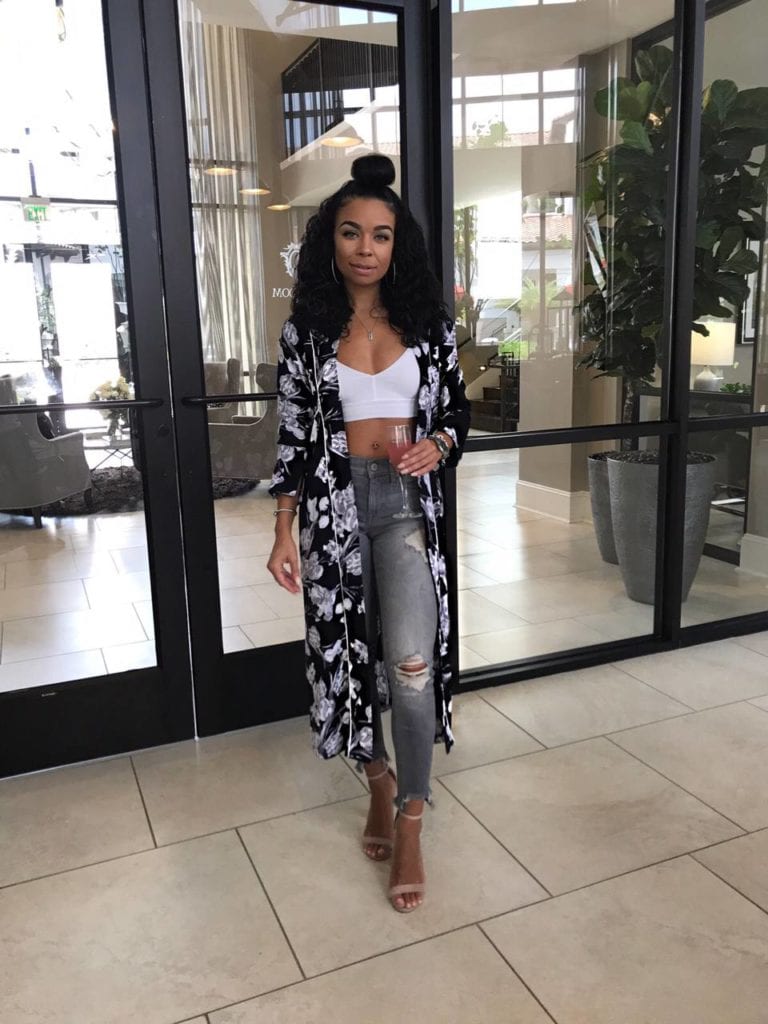 Woman in floral duster coat.