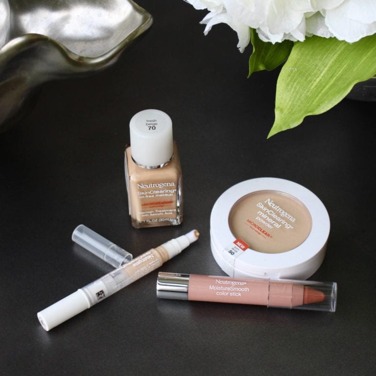 Neutrogena makeup products arranged artfully.