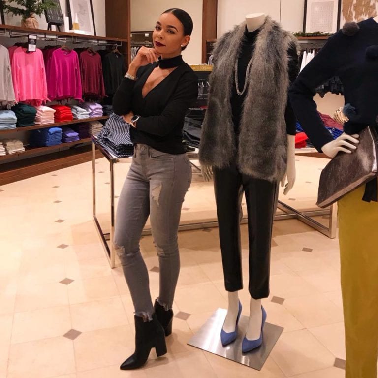 Woman posing in clothing store