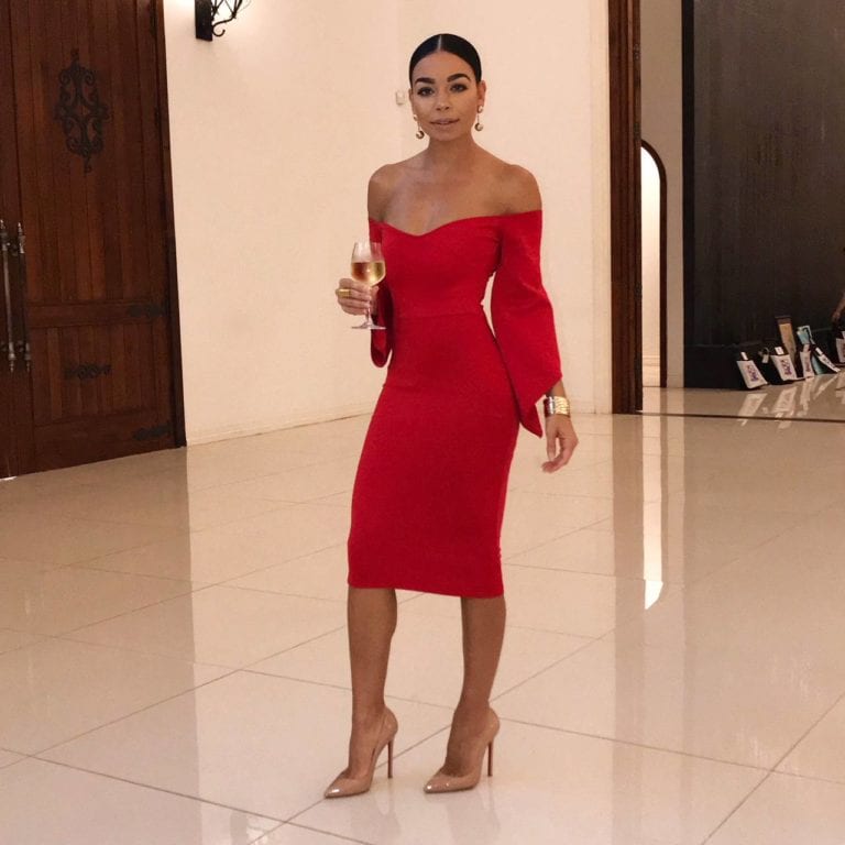 Woman in red off-shoulder dress
