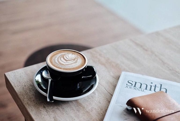 Latte art coffee with journal