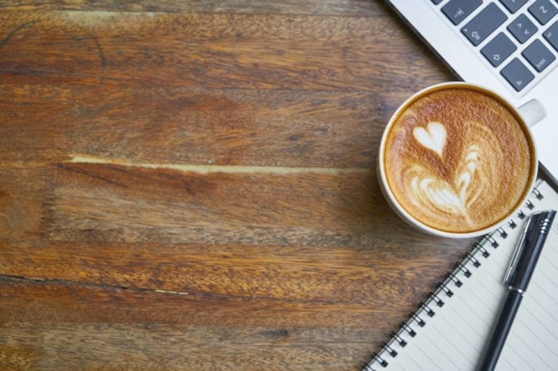 Latte art on coffee cup.