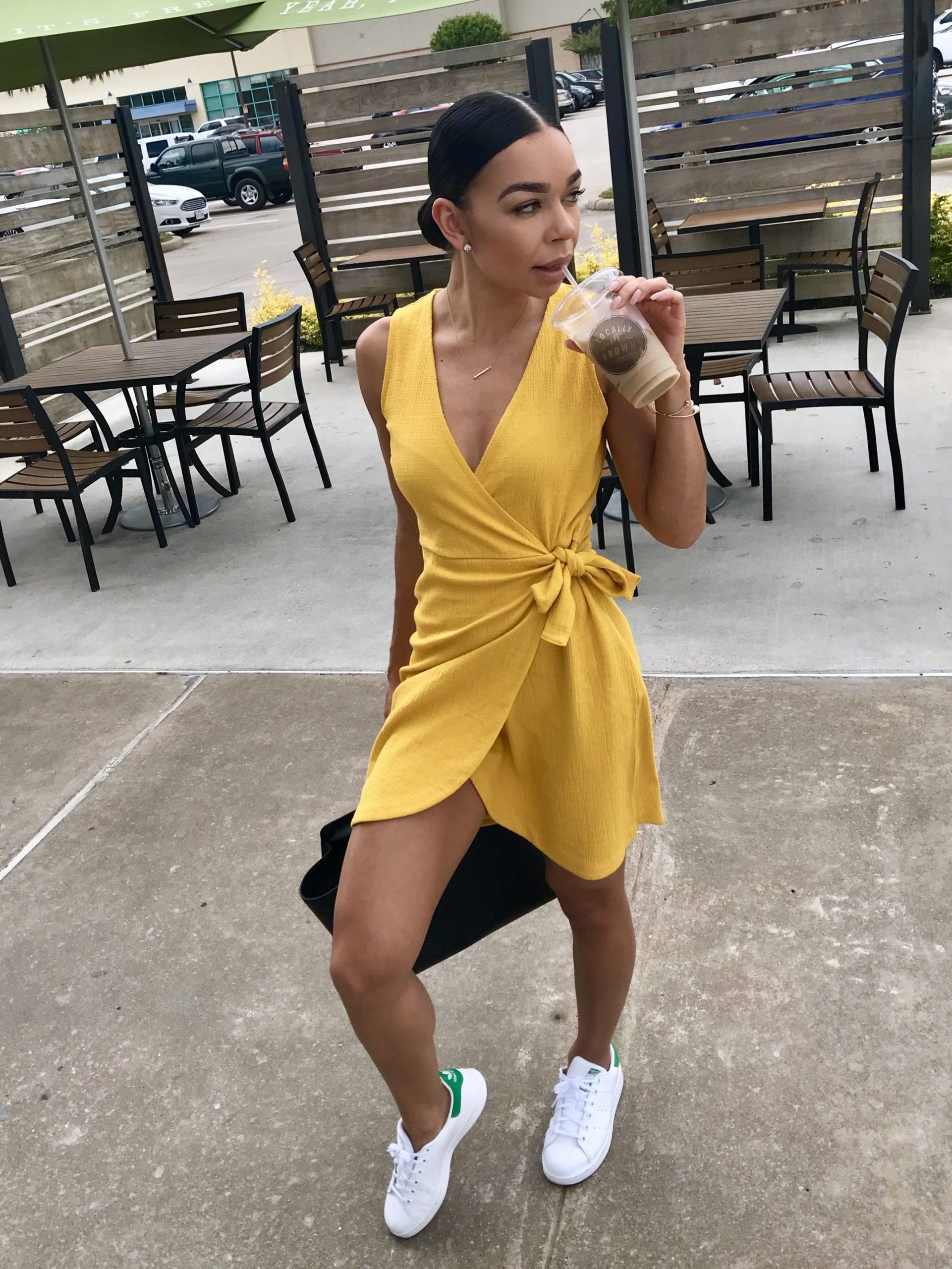Woman in yellow wrap dress.