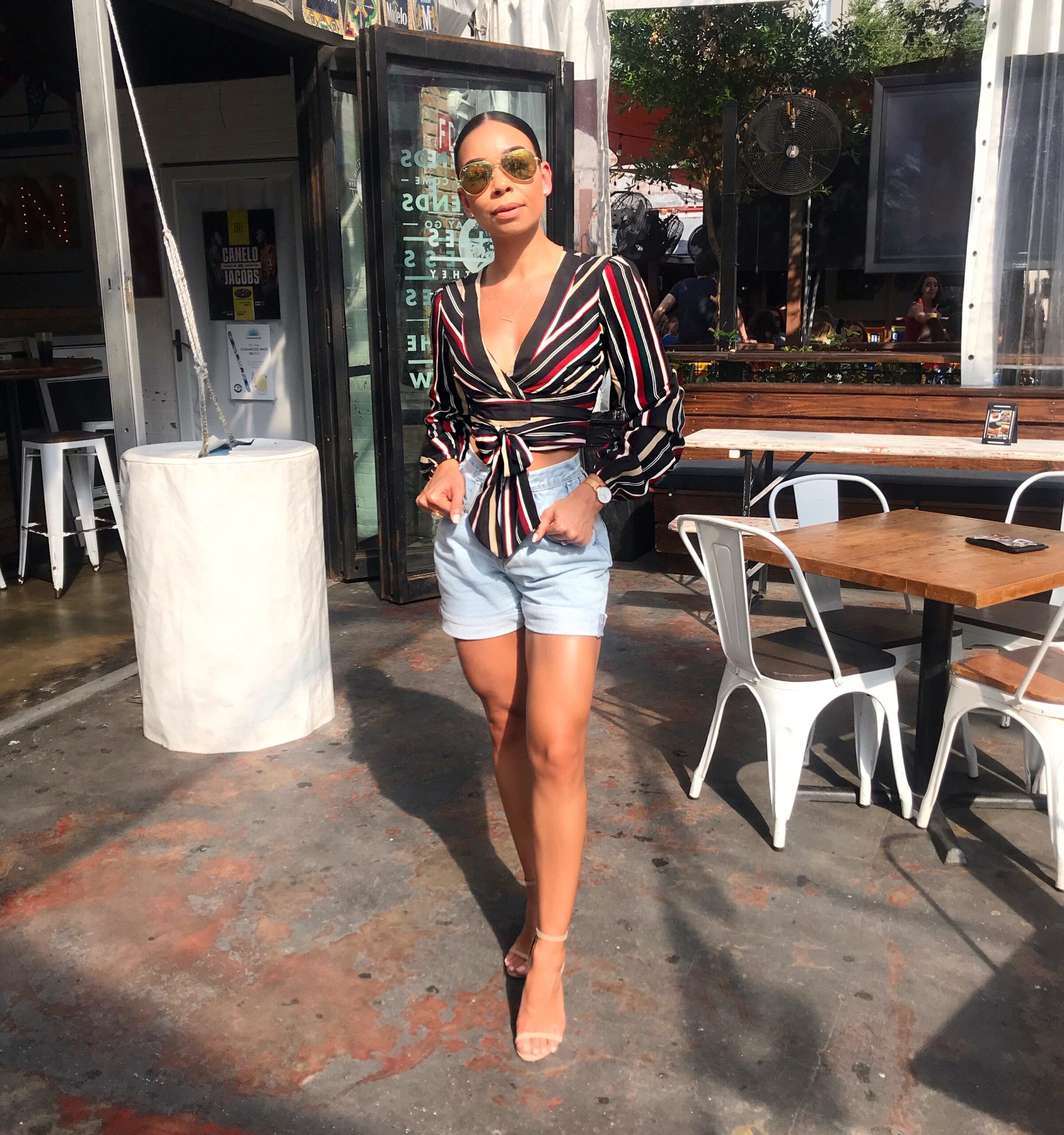 Woman in striped top and shorts