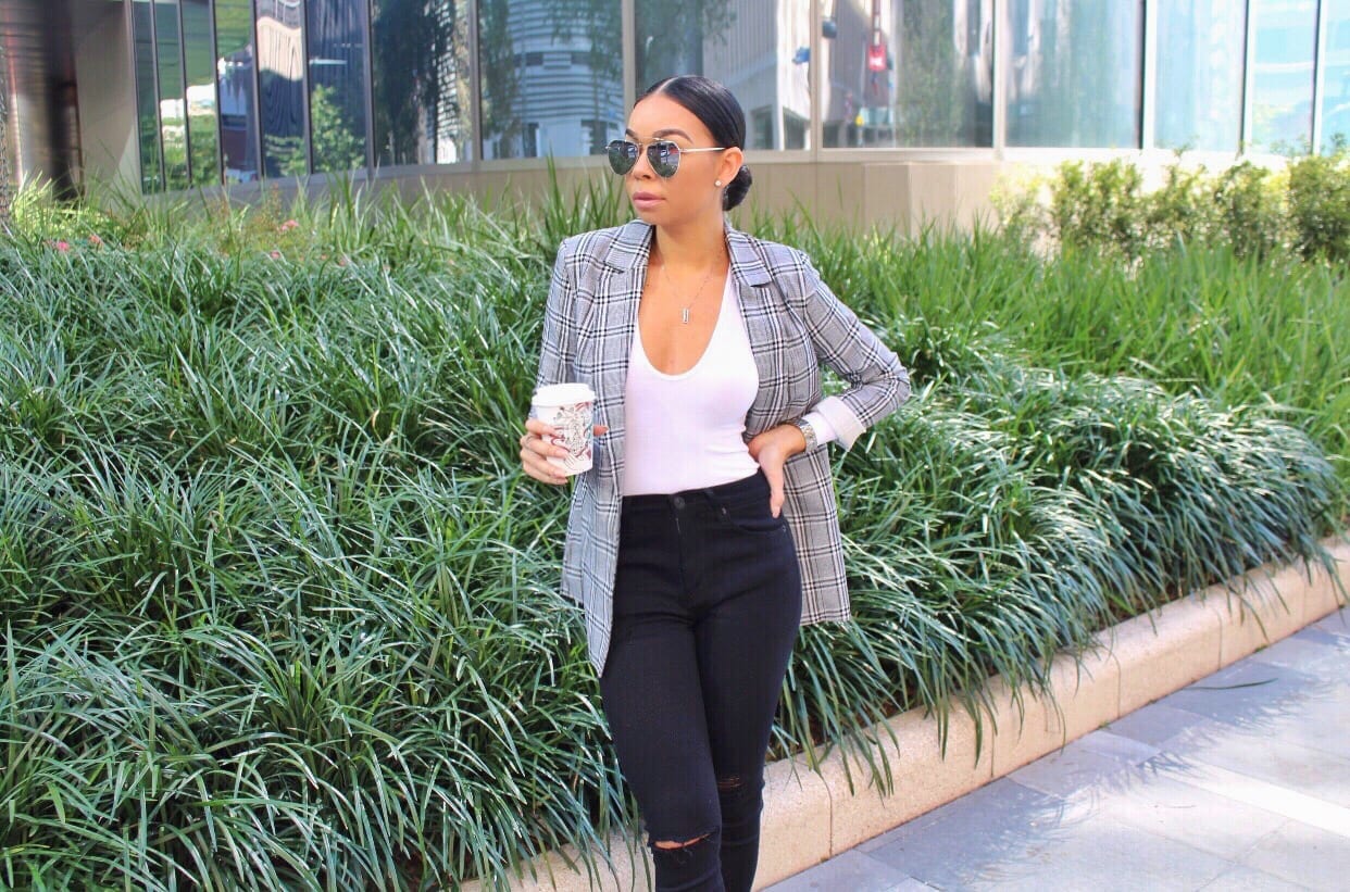 Woman in plaid blazer coffee