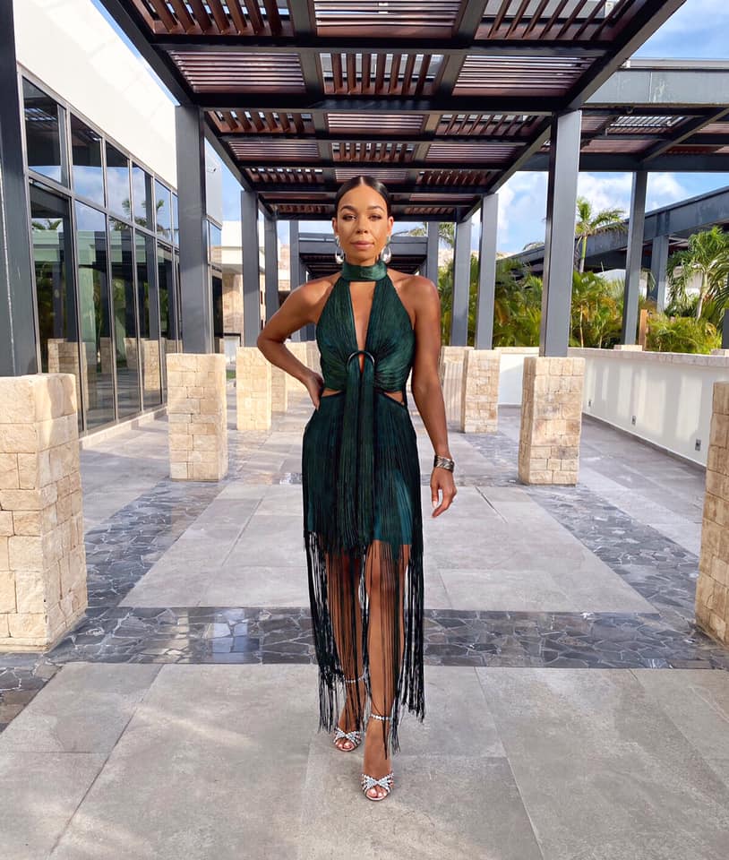 Woman in green fringe dress