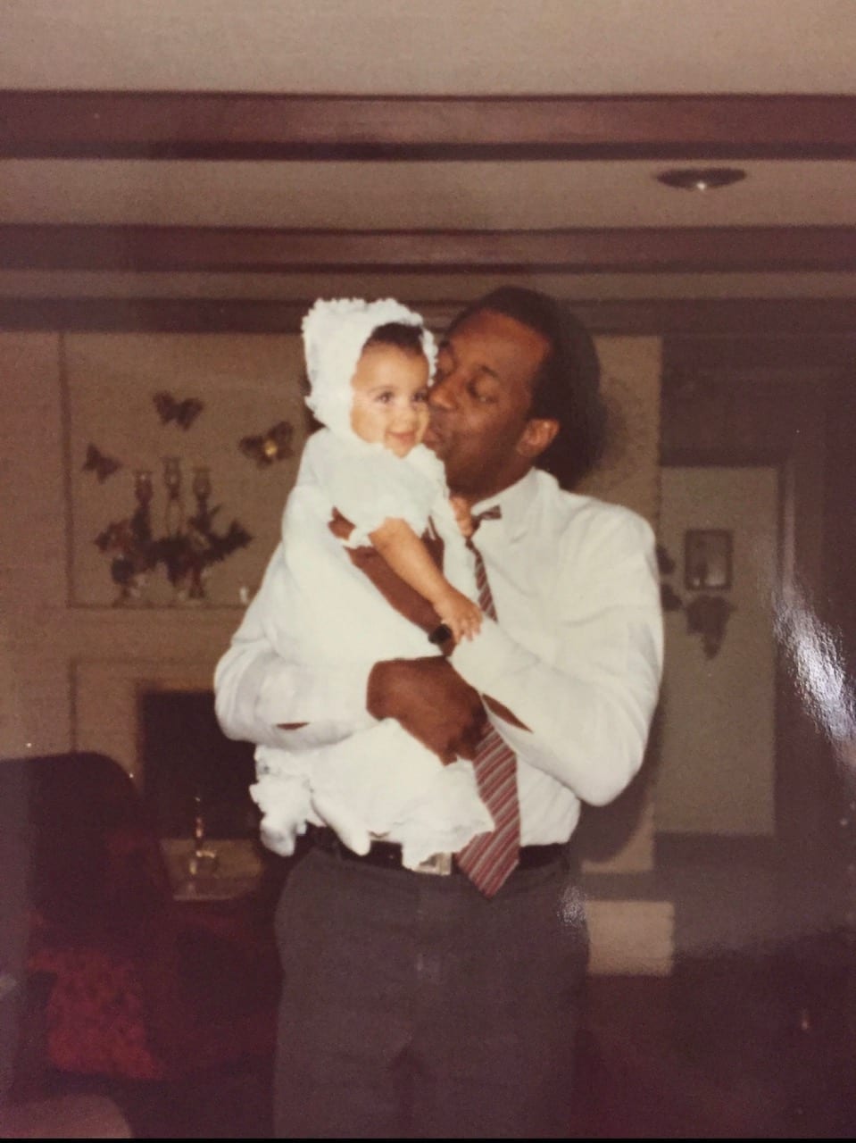 Father kissing baby's cheek